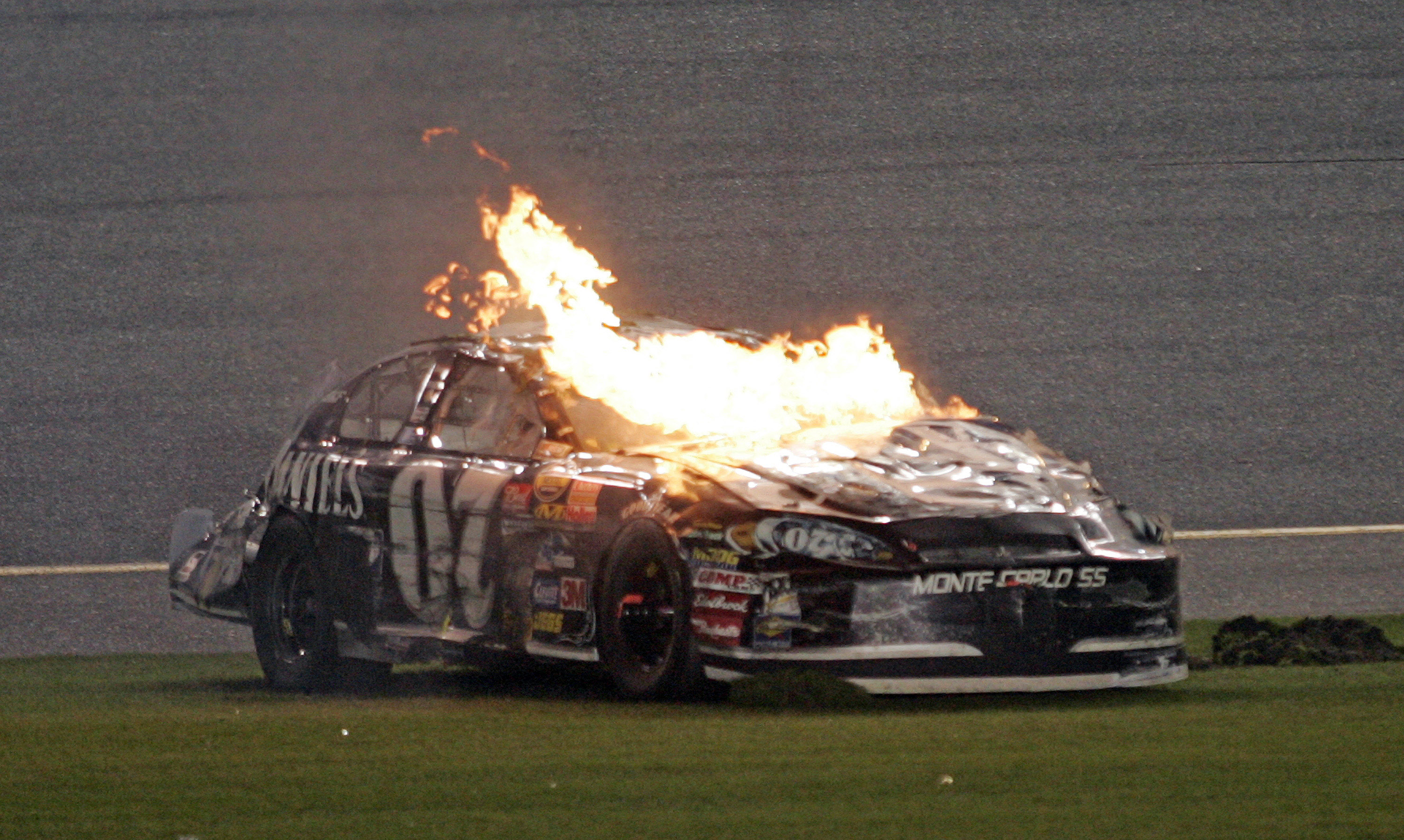 Clint Bowyer's car burnsafter a last lap crash in the NASCAR Nextel Cup Daytona 500 at Daytona International Speedway in Daytona Beach, Florida, Sunday, February 18, 2007. (Photo by Gregg Ellman/Fort Worth Star-Telegram/MCT via Getty Images)