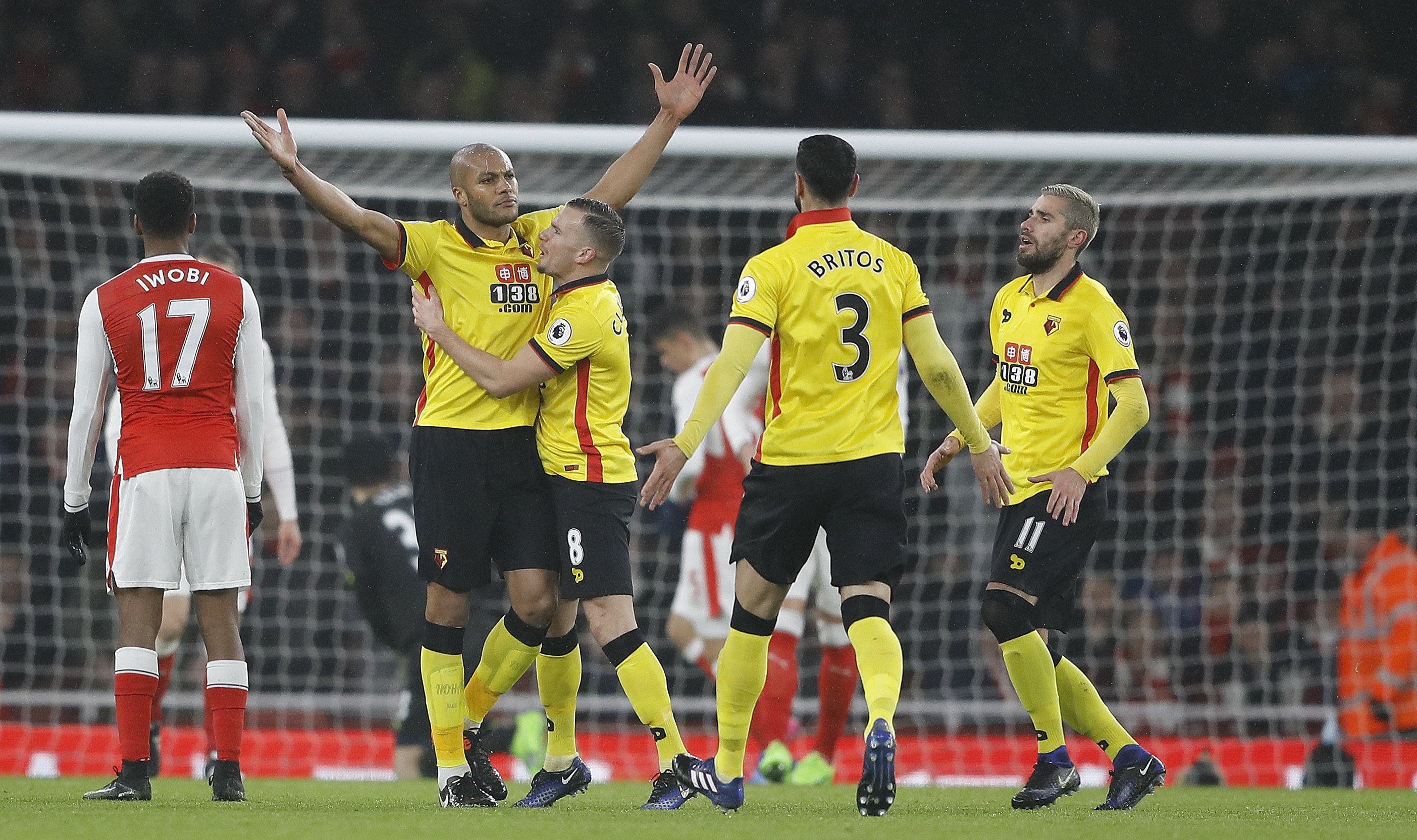 Watford's Younes Kaboul,second left, celebrates after scoring during the English Premier League soccer match between Arsenal and Watford at the Emirates stadium in London, Tuesday, Jan. 31, 2017. (AP Photo/Frank Augstein)