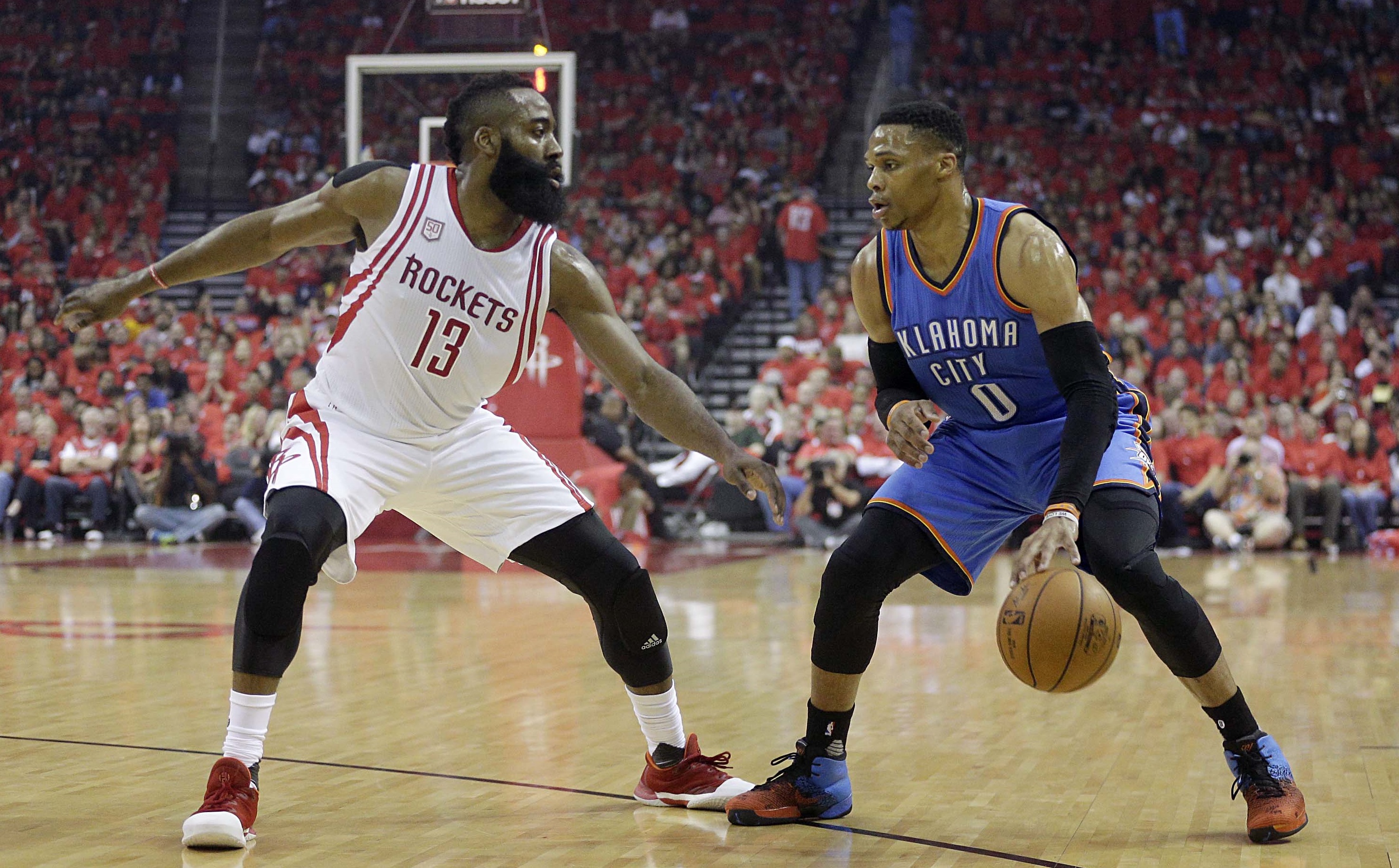 Apr 25, 2017; Houston, TX, USA; Oklahoma City Thunder guard Russell Westbrook (0) dribbles against Houston Rockets guard James Harden (13) in the first quarter in game five of the first round of the 2017 NBA Playoffs at Toyota Center. Mandatory Credit: Thomas B. Shea-USA TODAY Sports