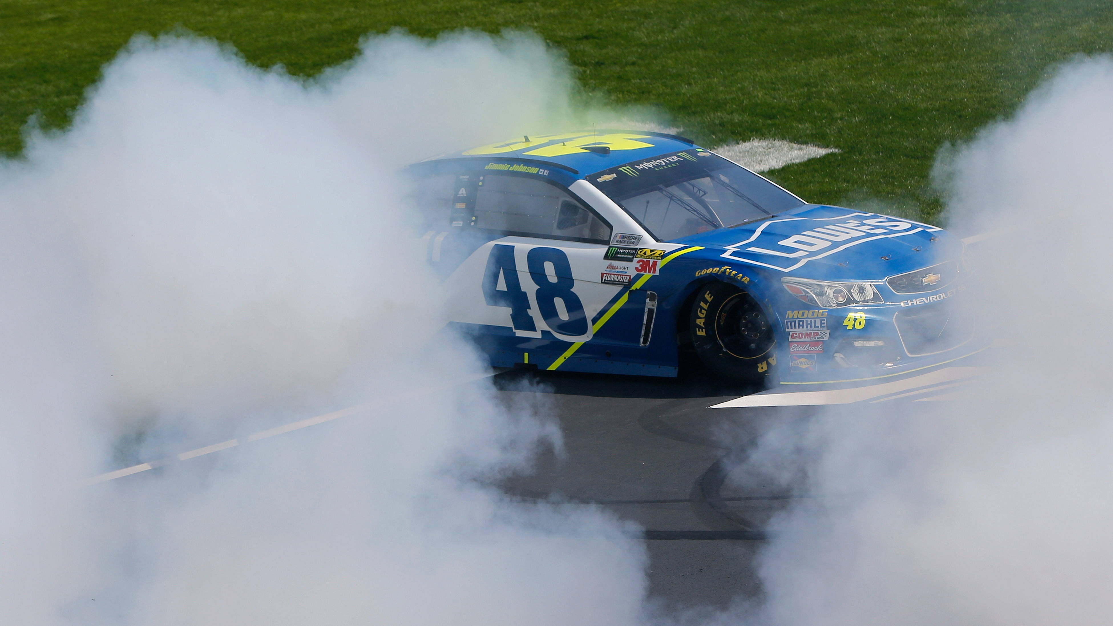 FORT WORTH, TX - APRIL 09:  Jimmie Johnson, driver of the #48 Lowe's Chevrolet, celebrates with a burn out after winning the Monster Energy NASCAR Cup Series O'Reilly Auto Parts 500 at Texas Motor Speedway on April 9, 2017 in Fort Worth, Texas.  (Photo by Jonathan Ferrey/Getty Images)