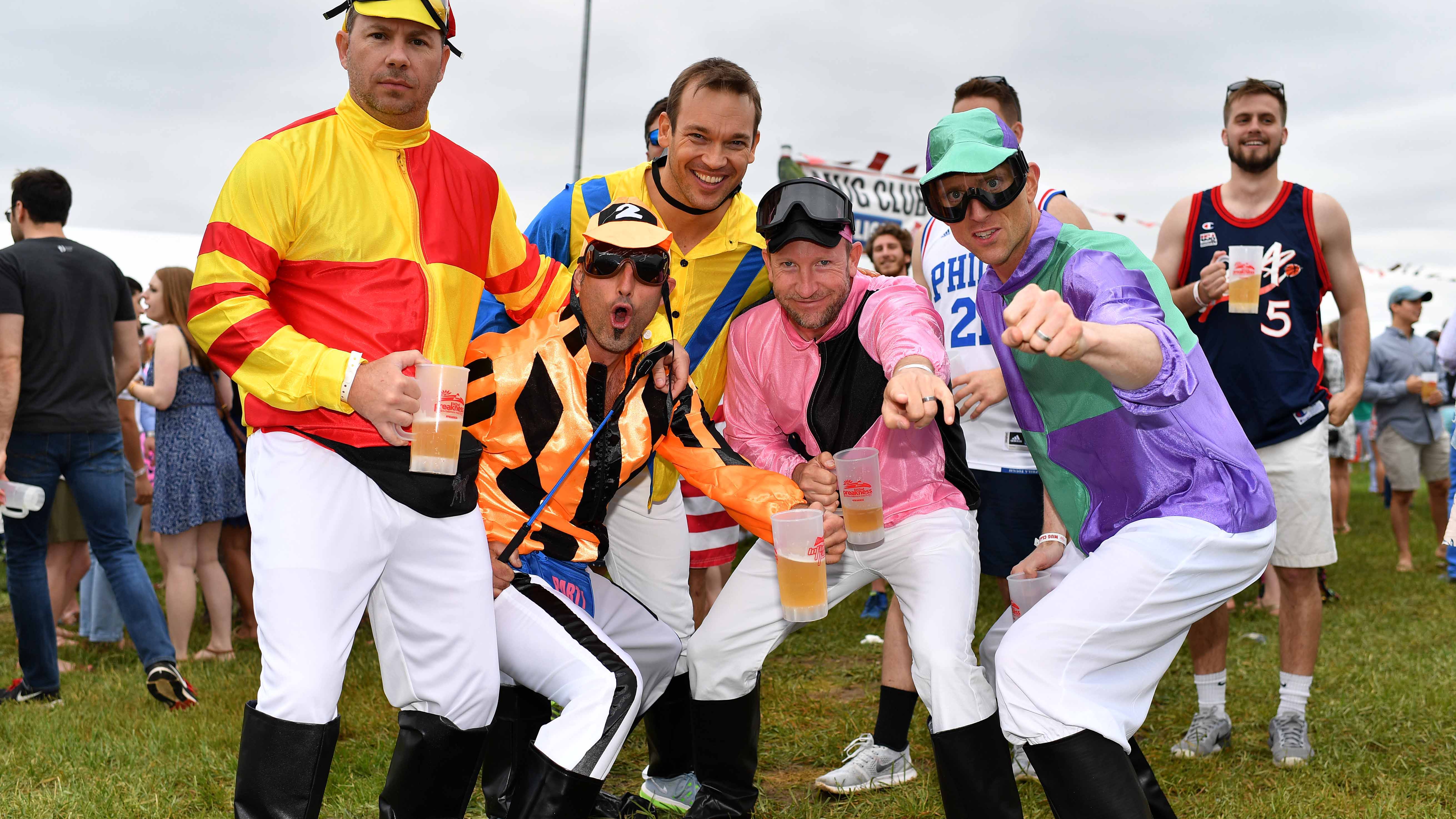 May 20, 2017; Baltimore, MD, USA; Fans pose for a photo as LoCash (not pictured) performs in the infield prior to the 142nd running of the Preakness Stakes at Pimlico Race Course. Mandatory Credit: Patrick McDermott-USA TODAY Sports