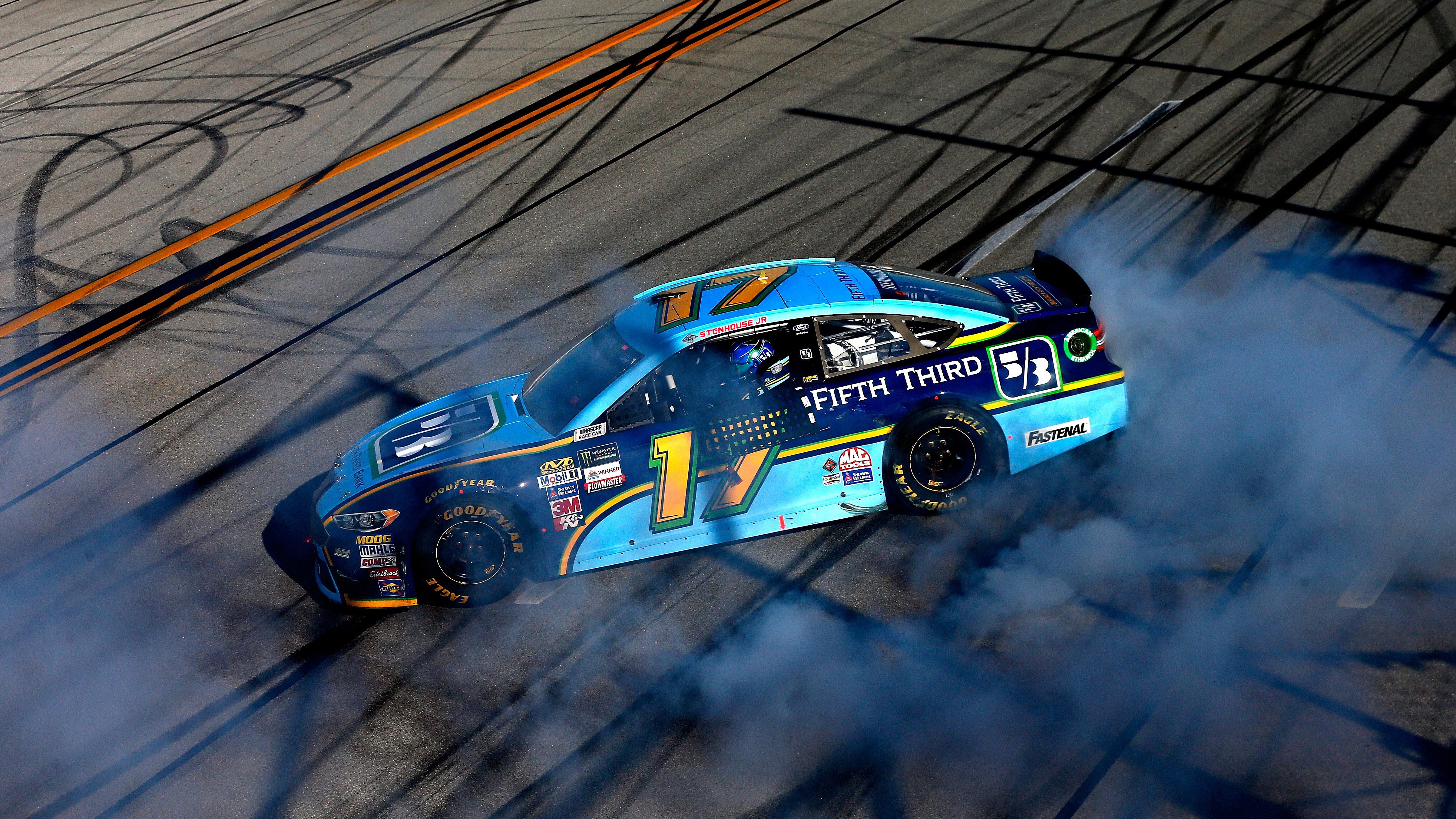 TALLADEGA, AL - MAY 07: Ricky Stenhouse Jr., driver of the #17 Fifth Third Bank Ford, celebrates with a burnout after winning the Monster Energy NASCAR Cup Series GEICO 500 at Talladega Superspeedway on May 7, 2017 in Talladega, Alabama. (Photo by Sean Gardner/Getty Images)