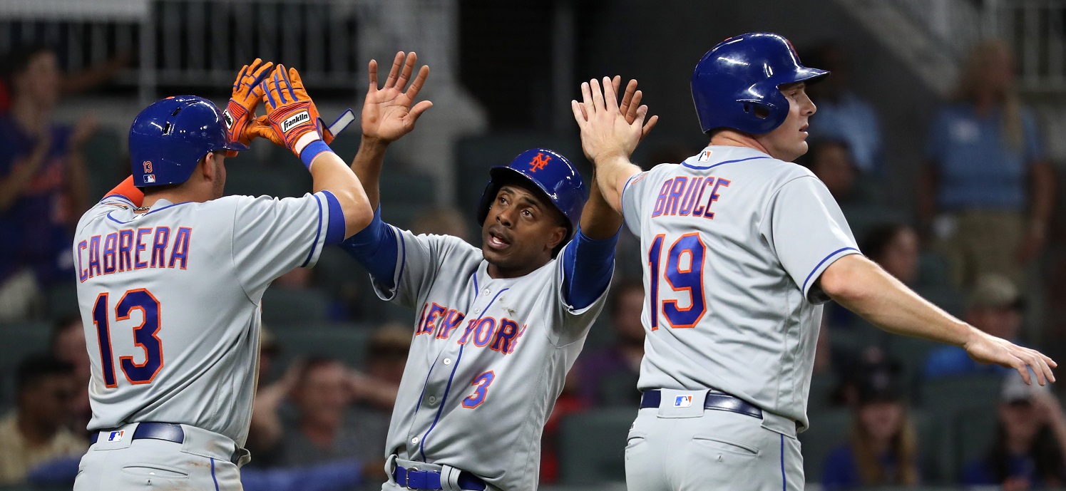 May 3, 2017; Atlanta, GA, USA; New York Mets shortstop Asdrubal Cabrera (13), center fielder Curtis Granderson (3) and right fielder Jay Bruce (19) celebrate after third baseman Jose Reyes (not pictured) hits a three-RBI double in the eighth inning of their game against the Atlanta Braves at SunTrust Park. Mandatory Credit: Jason Getz-USA TODAY Sports