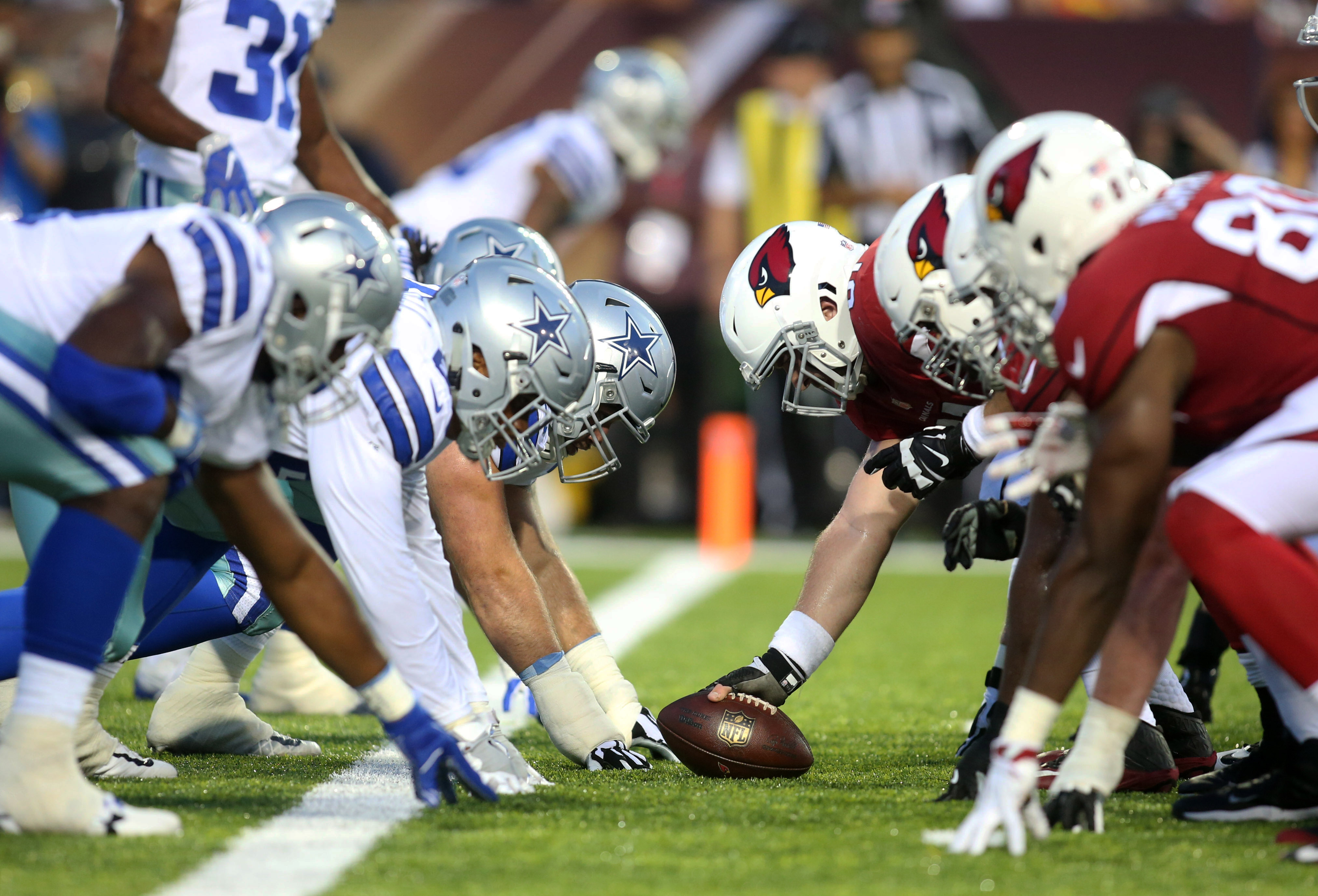 Aug 3, 2017; Canton, OH, USA;  The Arizona Cardinals offense lines up at the line of scrimmage against the Dallas Cowboys defense during the first quarter at Tom Benson Hall of Fame Stadium. Mandatory Credit: Charles LeClaire-USA TODAY Sports