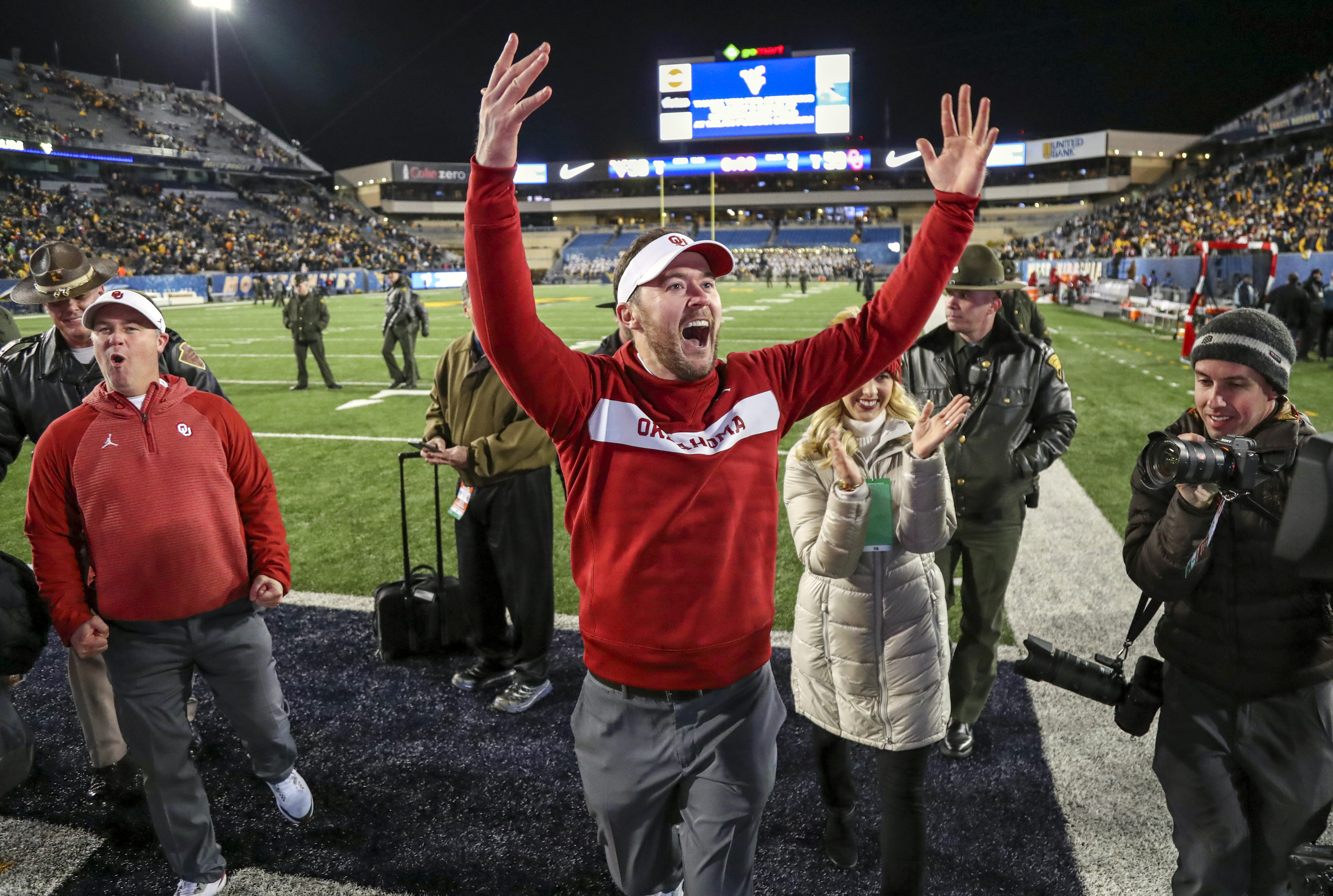 Nov 23, 2018; Morgantown, WV, USA; Oklahoma Sooners head coach Lincoln Riley celebrates with fans after beating the West Virginia Mountaineers at Mountaineer Field at Milan Puskar Stadium. Mandatory Credit: Ben Queen-USA TODAY Sports