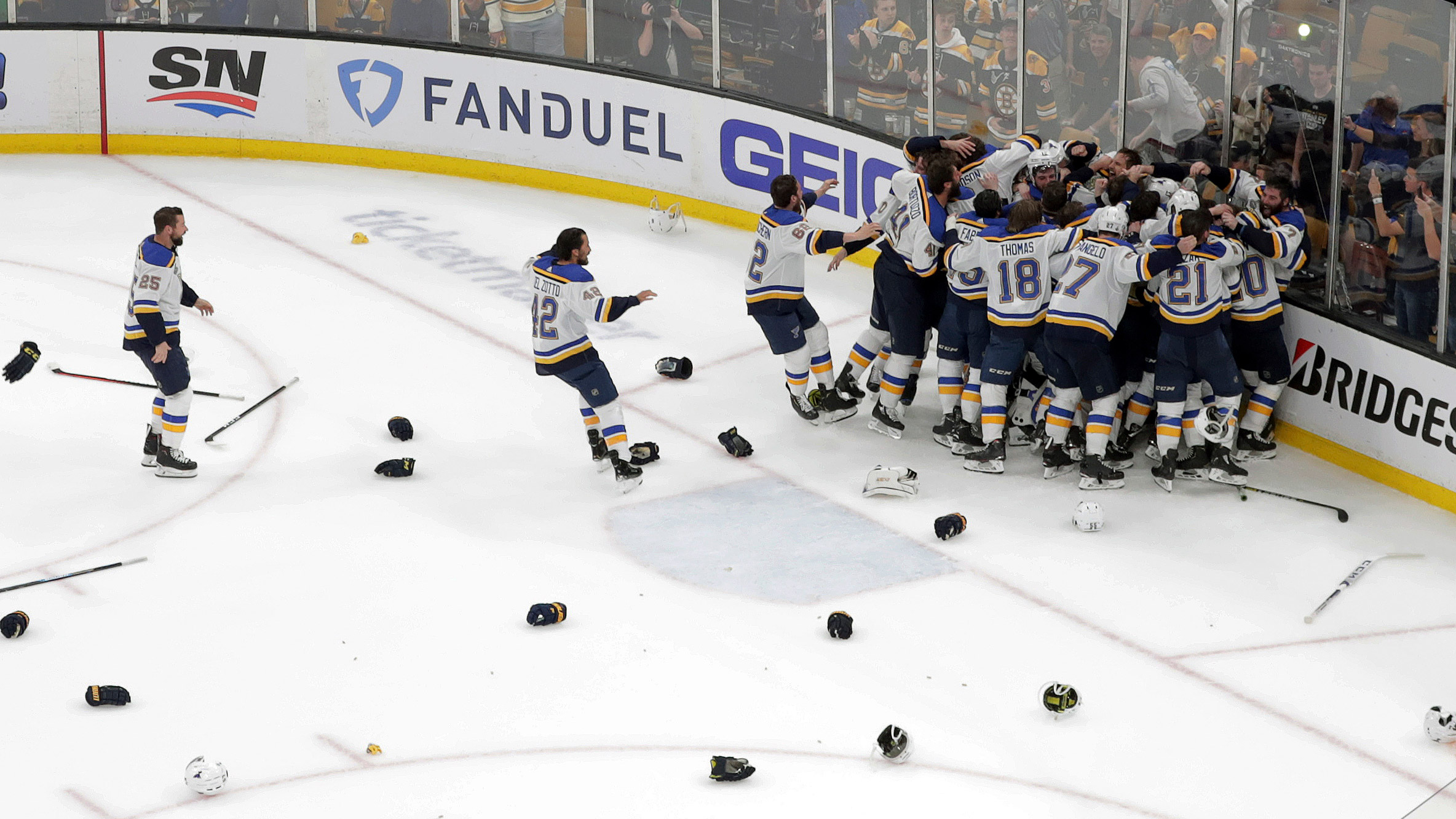 The St. Louis Blues celebrate their win over the Boston Bruins in Game 7 of...